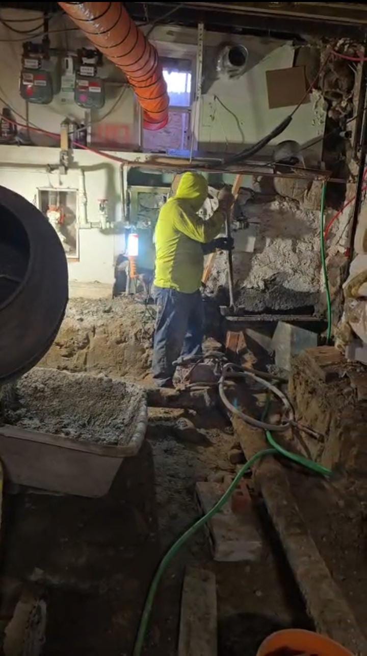 Basement waterproofing work in progress